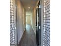 Inviting entryway featuring wood-look flooring, neutral walls, and a glimpse into the open-concept layout at 5322 Tolar Rd # 27, South Fulton, GA 30213
