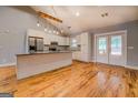 Open-concept kitchen featuring an island, granite countertops, and stainless steel appliances at 4979 Snook Thompson Se Rd, Oxford, GA 30054