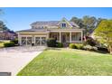 Charming home with a well-maintained lawn, a welcoming front porch, and a three-car garage at 237 Highcrest Dr, Acworth, GA 30101