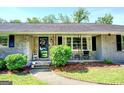 Charming front porch with decorative wreath and seating, offering curb appeal and a cozy welcome at 5327 David Se Cir, Covington, GA 30014