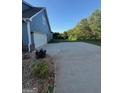 Wide paved driveway leads to the two-car garage of this two-story home at 808 Covered Bridge Rd, Covington, GA 30016