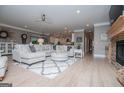 Bright living room features a fireplace, hardwood floors, and a comfortable sectional sofa at 1295 Heritage Dr, Villa Rica, GA 30180