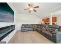 Open-concept living room featuring a fireplace and modern gray seating at 5237 Halcyon Ct, Morrow, GA 30260