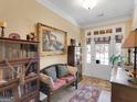Elegant foyer with beautiful flooring, wooden furniture and a decorative painting at 1141 Pebble Creek Ln, Locust Grove, GA 30248