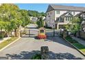 Gated community entrance with stone pillars and beautiful landscaping at 1112 Cordia Nw Ave, Atlanta, GA 30318