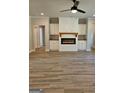 Cozy living room featuring hardwood floors and a modern fireplace with built-in cabinets at 1715 Crumbley Rd # 2, Mcdonough, GA 30252