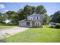 Attractive two-story home featuring a spacious driveway and green lawn at 6369 Havenridge Dr, Riverdale, GA 30274