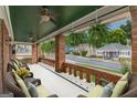 Inviting front porch with brick pillars, comfortable seating, and hanging plants, perfect for relaxing outdoors at 537 Winton Ne Ter, Atlanta, GA 30308
