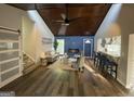 Open-concept living area featuring a fireplace, bar, and natural light at 783 Lost Creek Cir, Stone Mountain, GA 30088
