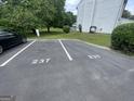 Assigned parking spaces with building number painted for easy identification at 237 Country Club Dr, Jonesboro, GA 30238