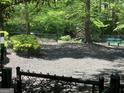 Community dog park is fenced and features green space and a convenient pet waste station at 3108 Westchester Ne Rdg, Atlanta, GA 30329