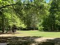 Expansive green space with mature trees provides a serene setting for outdoor activities and relaxation at 3108 Westchester Ne Rdg, Atlanta, GA 30329