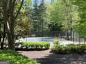 Outdoor tennis court with well-maintained landscaping and surrounding greenery in a desirable community at 3108 Westchester Ne Rdg, Atlanta, GA 30329