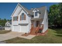 Two story home with two-car garage, updated with new deck and manicured front lawn, great curb appeal at 10074 Tara Glynn Dr, Hampton, GA 30228