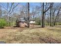 This two-story home features a blend of brick and siding, nestled in a wooded lot with mature trees at 40 Derby Country Dr, Ellenwood, GA 30294