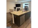 Stylish kitchen with granite countertops and stainless steel appliances, ideal for culinary enthusiasts at 11909 Lovejoy Crossing Blvd, Hampton, GA 30228