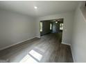 Open floor plan showcasing the spacious living area with hardwood floors and neutral walls at 30 Yellow Brick Way # 3, Covington, GA 30014
