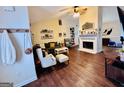 Inviting living room with a fireplace, hardwood floors, and tasteful decorations at 1741 Portwest Way, Hampton, GA 30228