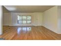 Bright living room with hardwood floors and ample space at 50 Caroline Ave, Stockbridge, GA 30281