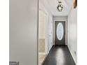 Inviting entryway showcasing hardwood floors and views of the kitchen at 135 Gingercake Ct, Fayetteville, GA 30214