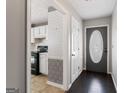 Inviting entryway showcasing hardwood floors and views of the kitchen at 135 Gingercake Ct, Fayetteville, GA 30214