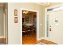 Foyer view flowing into dining room showcasing hardwood floors and a bright, welcoming ambiance at 17 Hampton Way, Carrollton, GA 30116