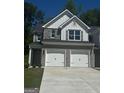 Charming new construction with brick accents, gray shutters, a well-manicured lawn, and a two-car garage at 1151 Park Center Nw Cir, Austell, GA 30168