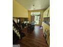 Spacious dining room with large window and access to kitchen at 6296 Marbut Farms Trl, Lithonia, GA 30058
