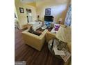 Inviting living room featuring sofas, and a bright, open floor plan at 6296 Marbut Farms Trl, Lithonia, GA 30058