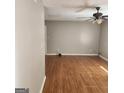 Spacious living room featuring neutral walls, vinyl flooring, and a ceiling fan at 3818 Mulkey Sw Cir, Marietta, GA 30008