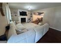 Cozy living room featuring a fireplace, hardwood floors, and neutral wall paint at 4080 Longford Ne Dr, Marietta, GA 30066