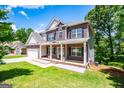 Charming two-story brick home with covered porch and well-manicured lawn at 137 River Birch Dr Dr, Carrollton, GA 30116