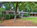 Traditional brick home with mature landscaping and cozy curb appeal in a serene setting at 1749 Creat Se Trl, Smyrna, GA 30080