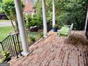 Welcoming front porch with a swing and garden view at 4710 Kinsmon Pl, Marietta, GA 30062