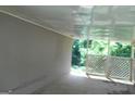 A covered carport area offering protection from the elements, with an exit to the back yard at 1391 Peachcrest Rd, Decatur, GA 30032