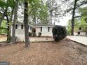 Inviting single-story home with light colored brick, well-kept garden and a driveway at 1814 Mary Lou Se Ln, Atlanta, GA 30316