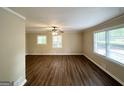 Bright, open living room featuring hardwood floors, ceiling fan and lots of natural light at 1814 Mary Lou Se Ln, Atlanta, GA 30316