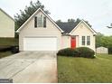 Charming single-Gathering home with a well-maintained lawn and attached two-car garage at 6861 John Clark Dr, Douglasville, GA 30134
