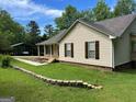 This home features nice landscaping and a convenient carport at 3725 Concord Rd, Newborn, GA 30056