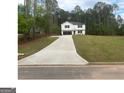 A sprawling front lawn leads to this charming two-story home with a spacious driveway at 35 Emerald Ln # 14, Covington, GA 30014