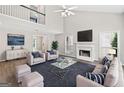 Bright living room with vaulted ceiling, fireplace, hardwood floors, and comfortable seating area at 2967 Albright Commons, Kennesaw, GA 30144