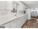 Bright kitchen featuring white cabinets, modern appliances, and great light at 5875 Highway 92, Fairburn, GA 30213