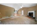 Living room with plush carpet, fireplace, and lots of natural light at 142 Pebblebrook Way, Temple, GA 30179