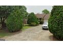 Cozy single-story home with a well-maintained lawn and a private driveway at 7369 Aubrey Dr, Riverdale, GA 30296