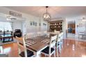 Spacious dining room featuring a large table, stylish decor, and hardwood floors at 1621 Dixie Rd, Covington, GA 30014