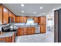 Well-equipped kitchen featuring stainless steel appliances, granite countertops, and ample cabinet space at 1621 Dixie Rd, Covington, GA 30014