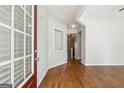 Welcoming foyer with hardwood floors, a decorative niche, and a view into the living spaces at 1363 Penhurst Dr, Lawrenceville, GA 30043