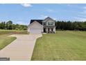 Beautiful front exterior of this two-story home, showcasing its inviting curb appeal and lush lawn at 715 Colvin Dr, Locust Grove, GA 30248