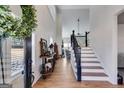 Bright foyer with high ceilings and hardwood flooring that leads to the staircase at 1721 Mcgarity Rd, Temple, GA 30179