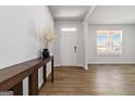 Inviting entryway with wood-look floors, a console table, and a view to the window, providing a bright and welcoming space at 3460 Sycamore Sw Dr, South Fulton, GA 30331